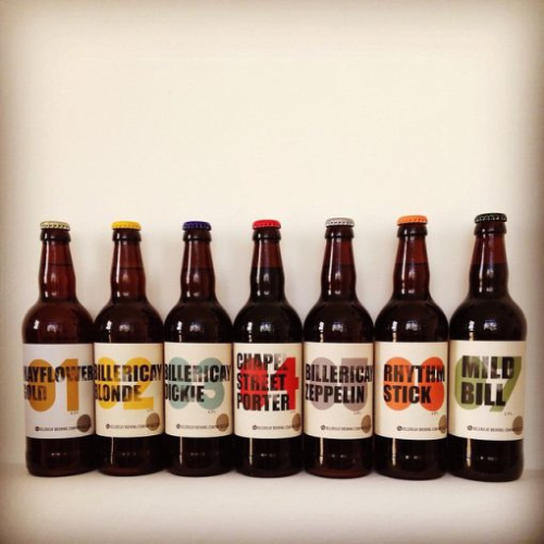 A selection of 7 different Billericay Brewing beers are lined up in a row against a white background.