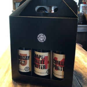 A black cardboard case containing 6 beers, decorated with a small Billericay Brewing Logo